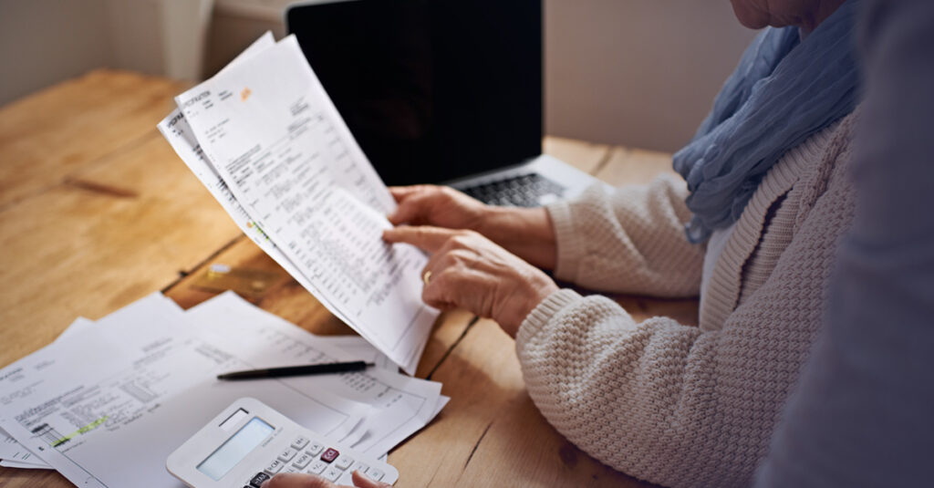 Veteran reviews medical paperwork and records while preparing a va disability claim.