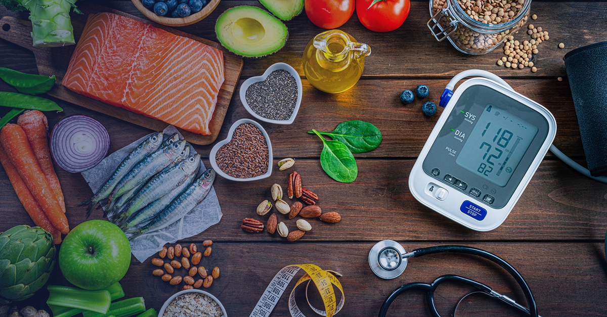 Healthy foods and a blood pressure monitor representing lifestyle factors in va hypertension ratings.