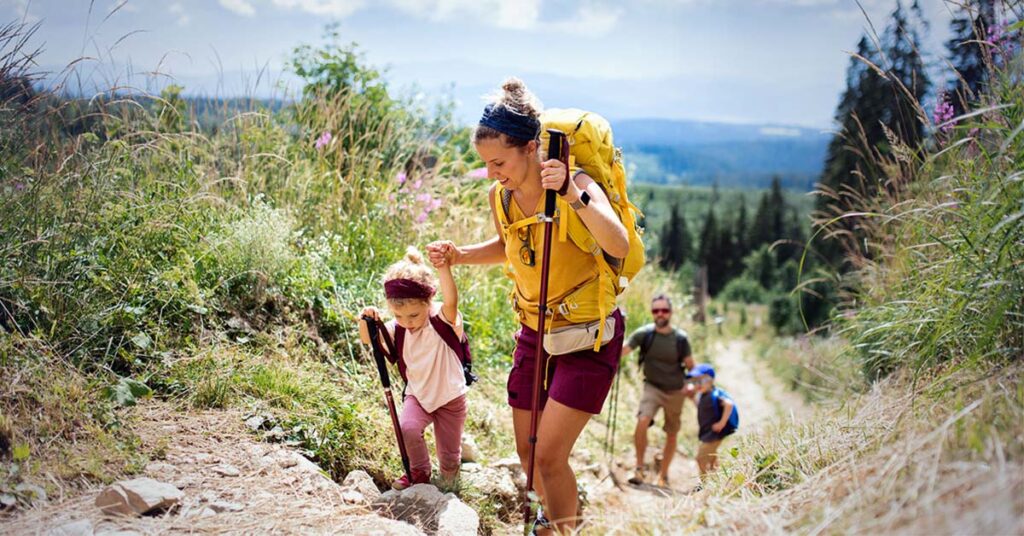 Happy veteran hiking after addressing IBS symptoms.