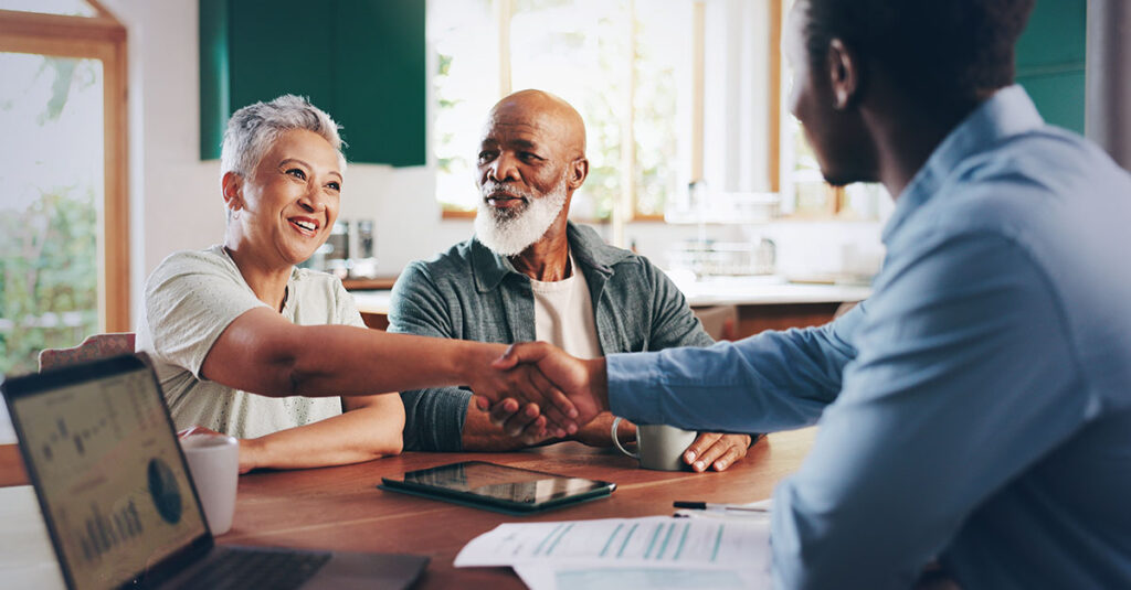 Veteran couple receiving support with paperwork.