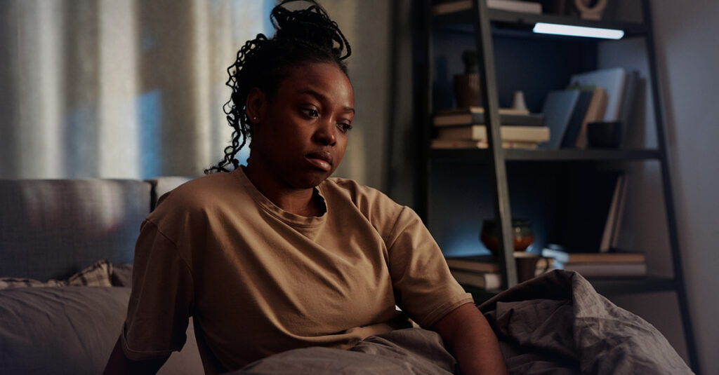 Veteran struggling with insomnia awake during the night.