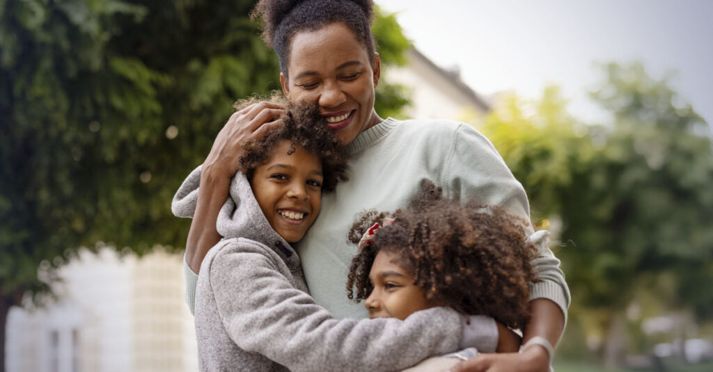 Veteran enjoying time with family after addressing migraine symptoms.