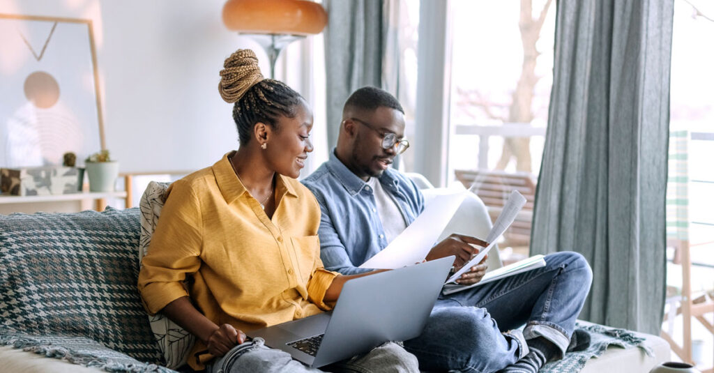 Veteran couple preparing VA paperwork together.