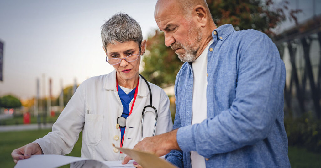 Veteran reviewing nexus letter with medical professional.