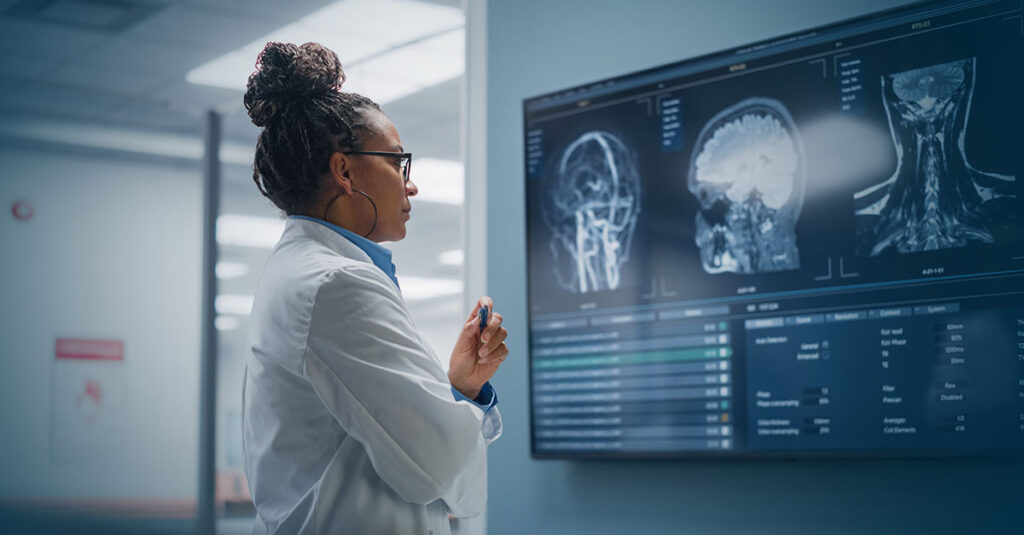 Medical professional reviewing a brain scan.