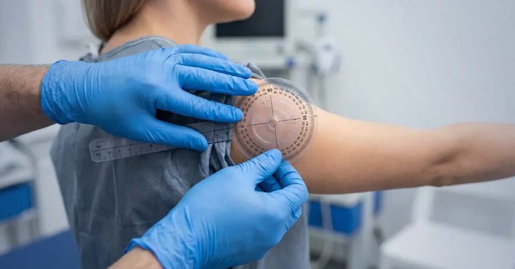 Goniometer measuring arm range of motion.