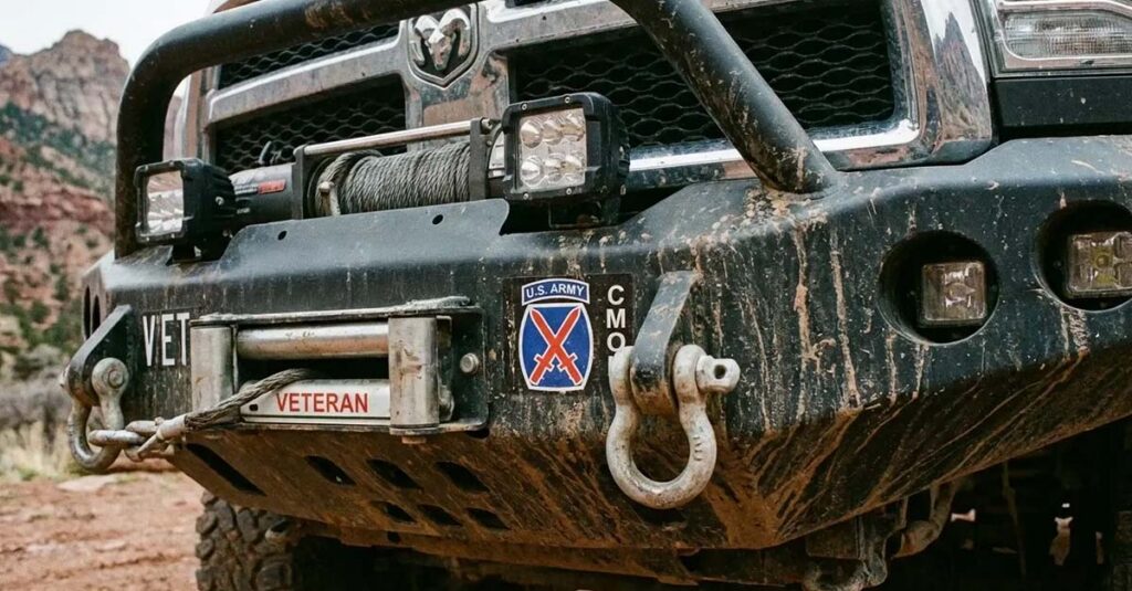 4x4 front bumper displaying various Veteran markings.