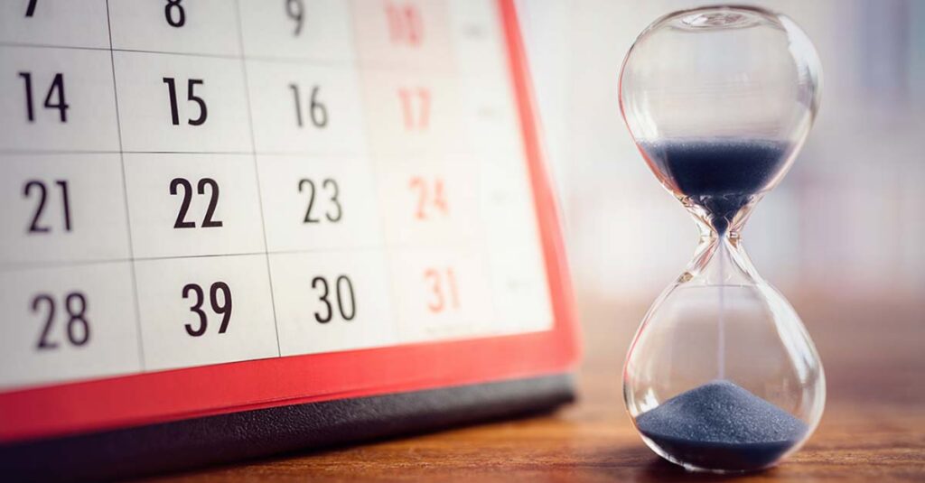Calendar with hourglass.